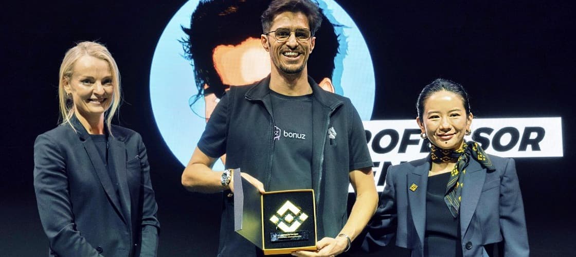 Matthias Mende receiving the Binance Creator of the Year award on stage at Binance Blockchain Week Dubai 2024